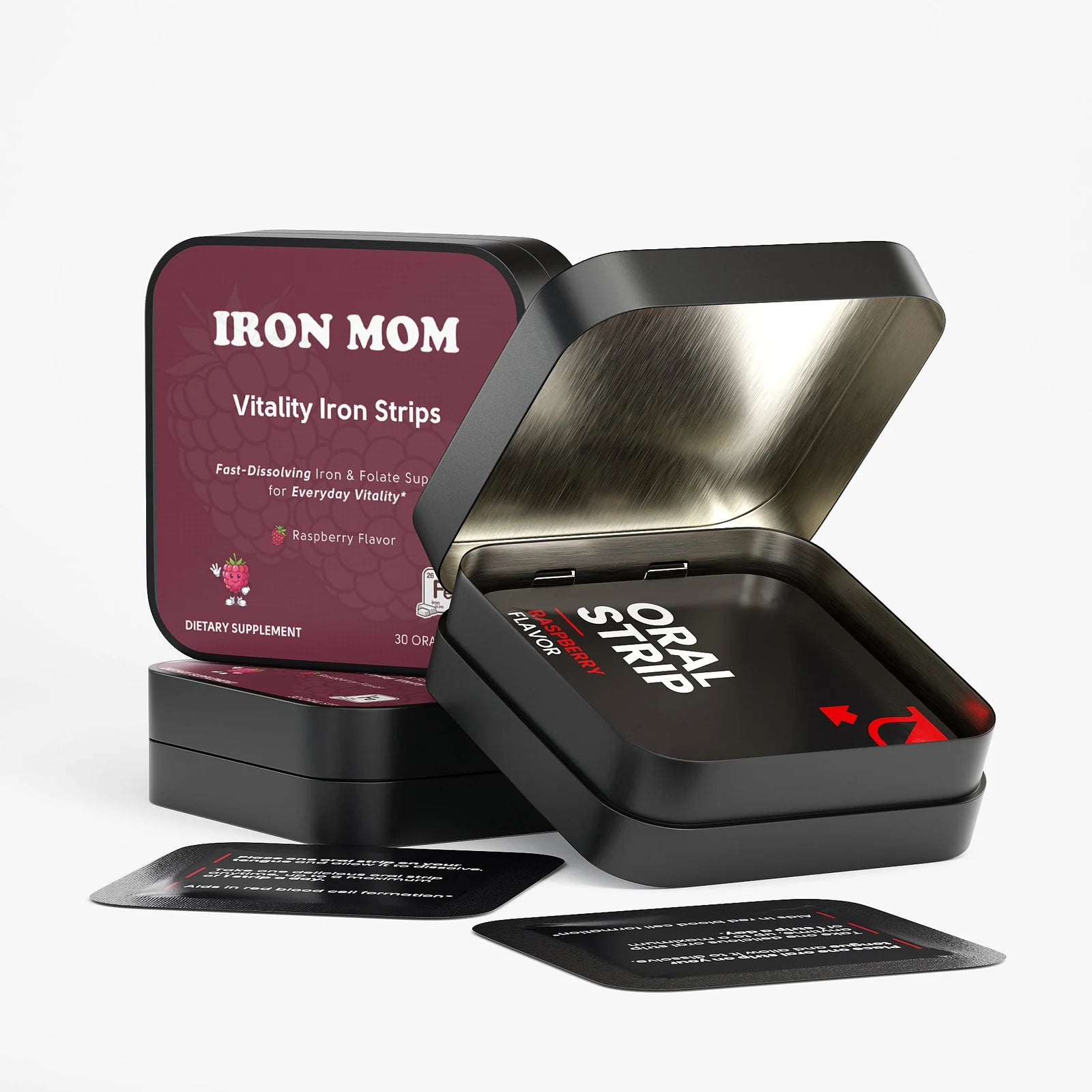 Open Iron Mom tin with a wrapped raspberry oral strip inside, next to stacked tins